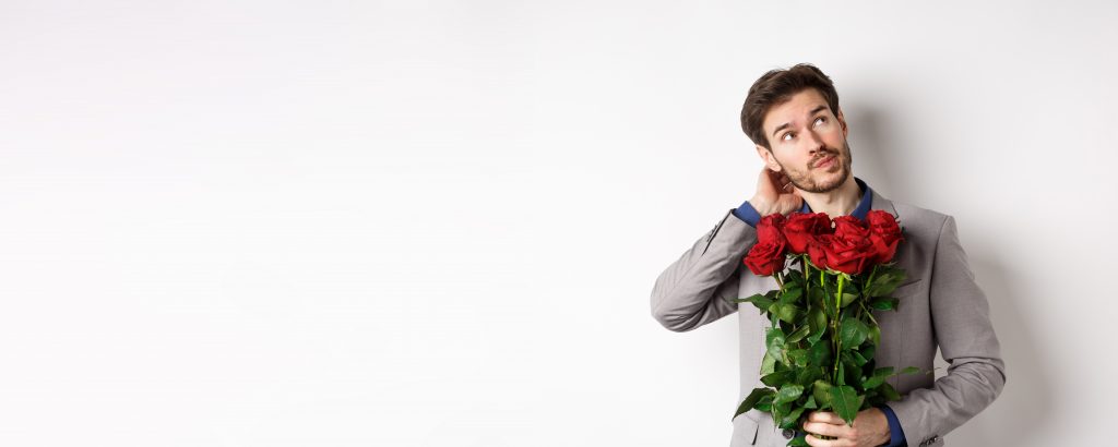 homme élégant avec un bouquet de rose